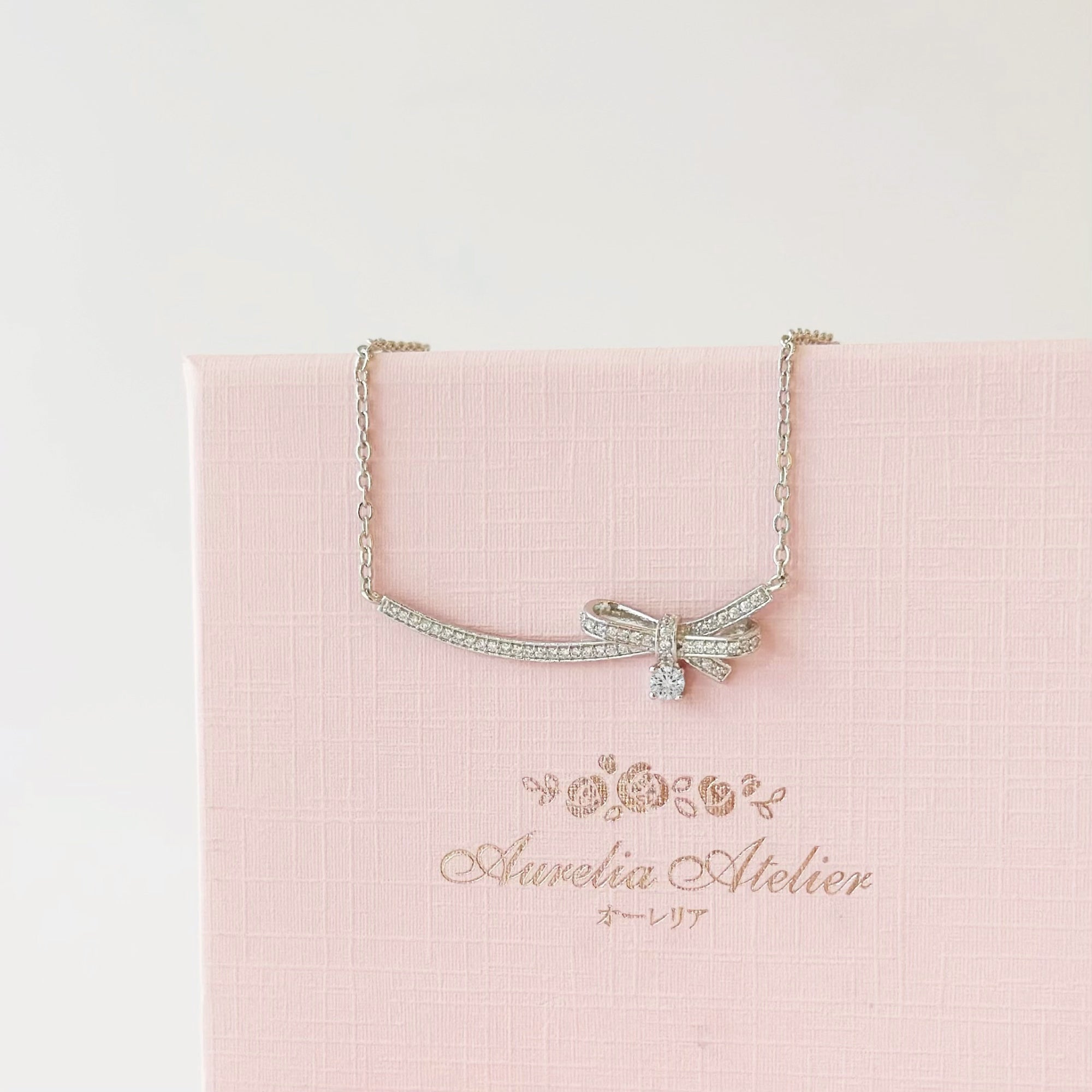 Silver Dear Love Ribbon Necklace with pavé cubic zirconia bow design, 925 sterling silver rhodium plated, by Aurelia Atelier, IU, perfect crown, kdrama earrings, chanel earrings, ruban, 蝴蝶结耳环，镶嵌密钉立方氧化锆，925纯银镀铑, 