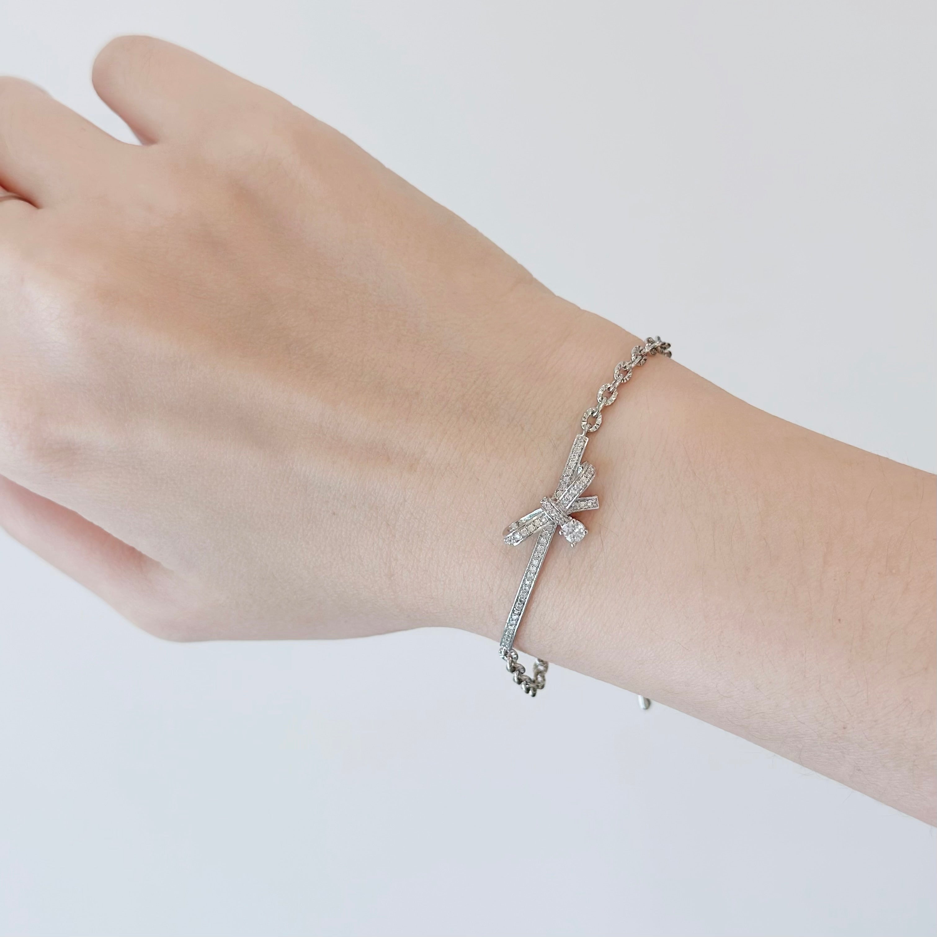 Silver Dear Love Ribbon Bracelet with pavé cubic zirconia bow design, 925 sterling silver rhodium plated, by Aurelia Atelier, IU, perfect crown, kdrama earrings, chanel earrings, ruban, 蝴蝶结耳环，镶嵌密钉立方氧化锆，925纯银镀铑, 