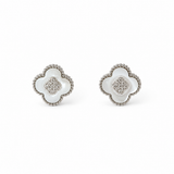 A pair of silver-toned four-leaf clover stud earrings with white inlay and a textured beaded border, set against a plain white background.